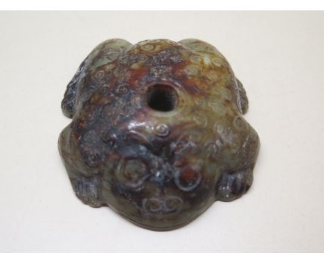 A well carved celadon and russet jade toad, 2.5cm tall x 8cm x 7cm in good condition and no obvious damage 