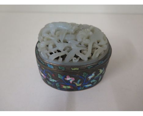 An enamel decorated Chinese pot with a carved jade dragon top, 7cm tall x 10cm x 8cm, in good condition, minor wear to jade, 