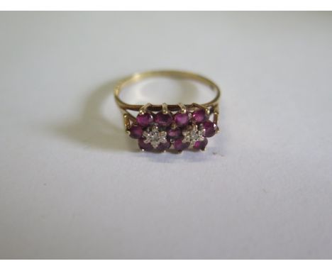 A hallmarked 9ct yellow gold diamond and ruby cluster ring, size U, approx 2.5 grams, in good condition 