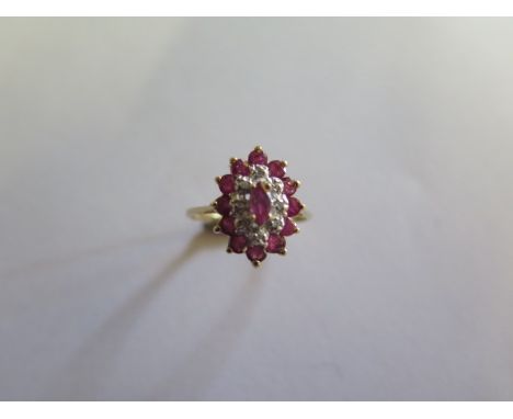 A hallmarked 9ct ruby and diamond yellow gold cluster ring, size O, approx 3.3 grams in good condition 
