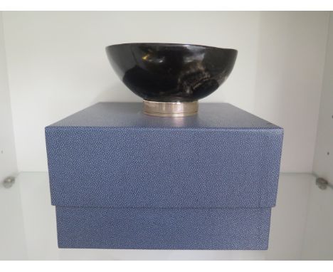An unusual horn bowl with silver base ring, London 2000 M &amp; A Co, 8cm tall x 16cm x 17cm 