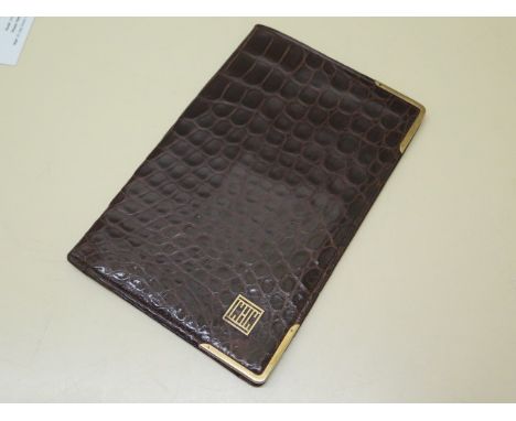 A good quality Mappin and Webb crocodile wallet with hallmarked 9ct yellow gold front corners, with a light tan leather inter