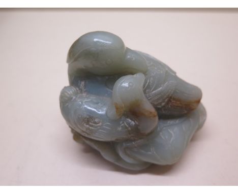 A carved jade duck and duckling on a lily leaf, 7cm tall x 8cm x 6cm, in good condition no obvious damage 