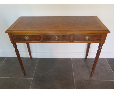 A new walnut three drawer hall table on turned reeded legs made by a local craftsman to a high standard, 76cm tall x 107cm x 