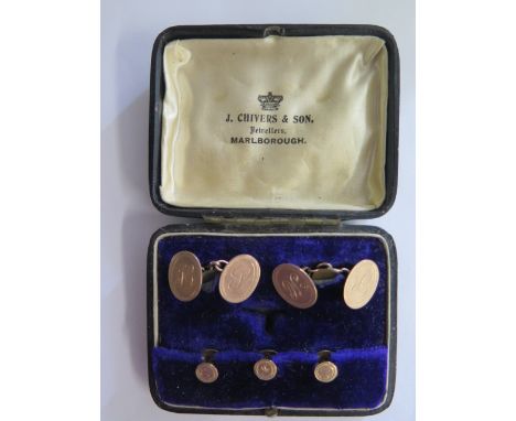 A boxed set of gold plated cufflinks and stud set, all engraved, some wear to cufflinks, and a gilt metal pearl and ruby broo