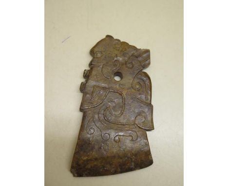 A russet carved jade pendant, 9cm x 5cm, small chips to three corners otherwise good 