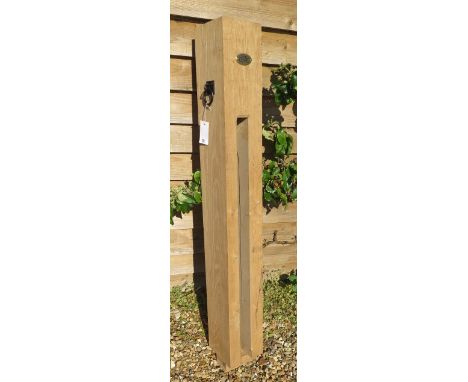 A new green oak bicycle lock post, 157cm tall x 19cm x 19cm with plaque and ring plate 