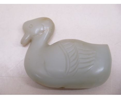 A carved jade duck pendant, 6cm x 4.5cm, in good condition 