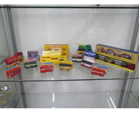 A collection of 14 Matchbox and Mayfield Crafts vehicles including a Fruehauf Hopper train, all generally good, track on snow