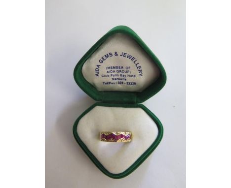 An 18ct yellow gold ruby and diamond ring, size P/Q, approx 5.7 grams, marked 750 some small usage marks but generally good 