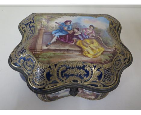 A continental hand decorated shaped porcelain trinket casket with serves style mark, 11cm tall x 23cm x 19cm, some small wear