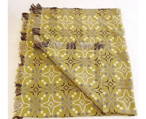 A vintage Welsh tapestry blanket in green