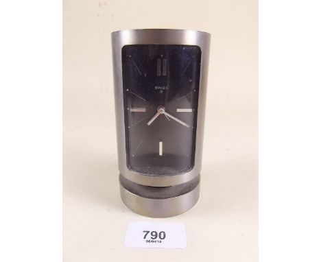 A vintage Swiza 8 cylindrical alarm clock
