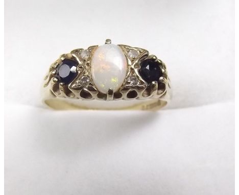 A 9 carat gold sapphire and opal ring with chip diamonds - size K