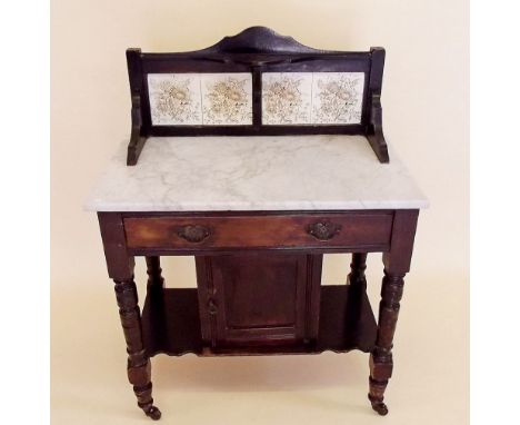 A small marble topped and tile back washstand with drawers and cupboard