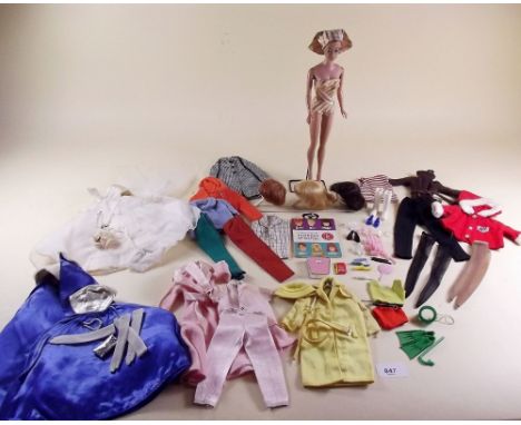 A 1965 Barbie Doll with three wigs and original bathing costume together with accessories and leaflet plus four Barbie 1960's