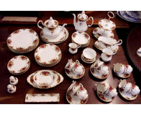 A Royal Albert tea and dinner service comprising teapot, coffee pot, sugar, milk and cream, sandwich plate, six tea cups and 