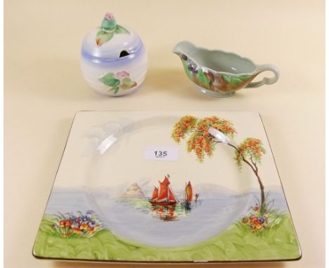 A group of Clarice Cliff to include apple shaped preserve pot, oblong plate painted harbour scene and a sauce boat - good con