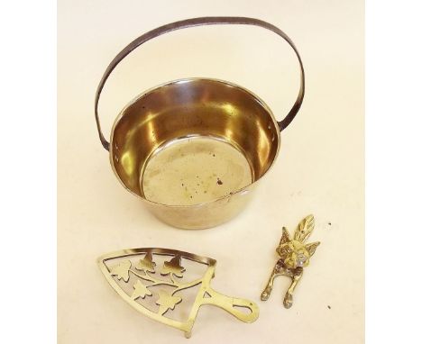 A brass preserving pan, fox door knocker and trivet