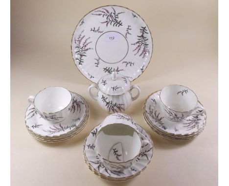 A Royal Worcester Dunrobin part tea service comprising cake plate, three cups and six saucers, six tea plates and sugar