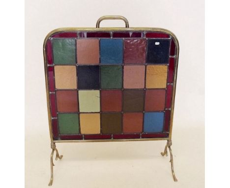 An Edwardian brass and stained glass firescreen- one glass a/f