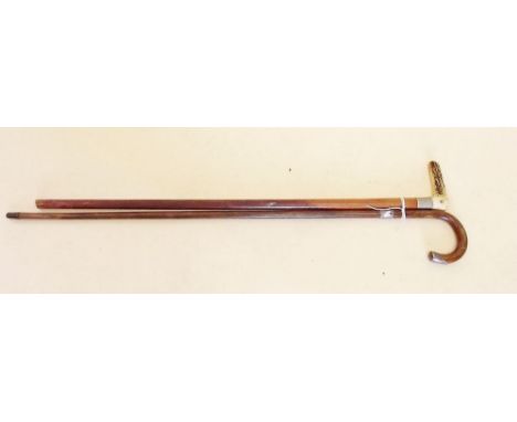 A silver mounted walking stick and a horn handled one