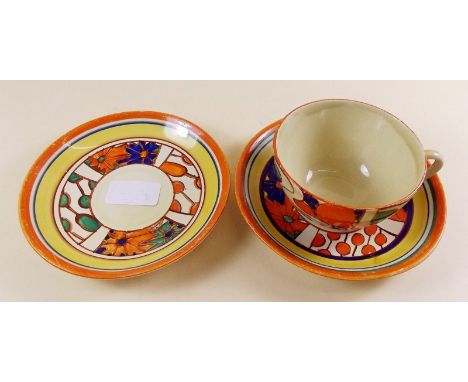 Two Clarice Cliff Umbrella and Rain saucers and a similar unmarked cup - good condition