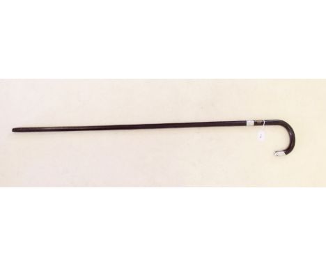 An ebony walking stick with silver collar and top, by Henry Howell and Co - Birmingham 1909