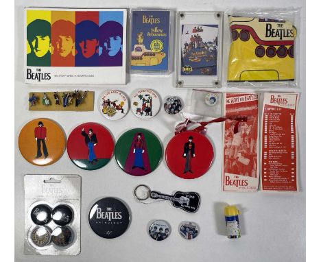 A collection of Beatles-related ephemera to include: a sticky notepad, an inflatable Yellow Submarine, a sealed Yellow Submar