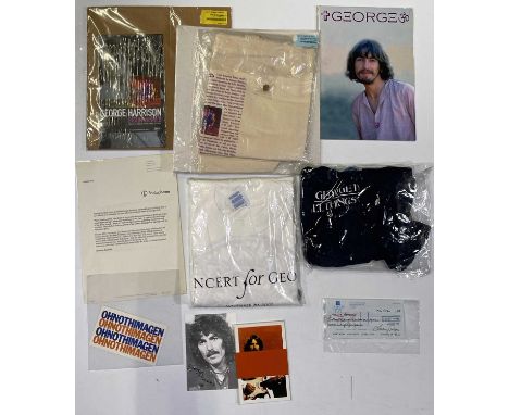 A collection of George Harrison promo items to include: a Lucy Rigo signed George Harrison personal cheque, a Brainwashed pro