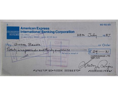 An American Express cheque for 'Harrisongs Ltd' dated 28th July 1987. Issued to Ginger Baker for amount of £29.31 and signed 