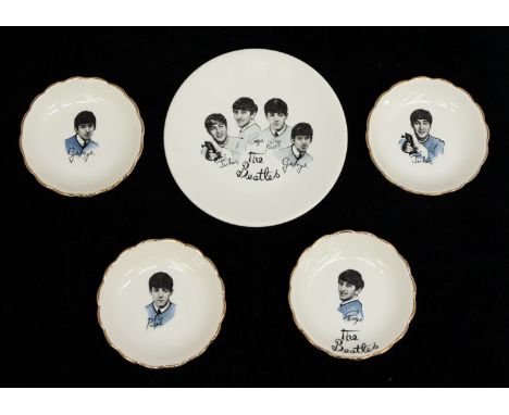 The Beatles - A collection of 4 ceramic pin dishes, Paul, Ringo, George and John together with a plate with transfer image of