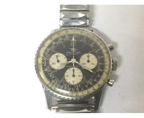 A Vintage 1967 Stainless Sterl Breitling Navitimer 806. Chronograph with silvered subsidiary dials on a black multi dial all 