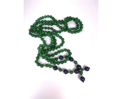 A green jade open necklace (scarf) inset with lapis and 14K beads.