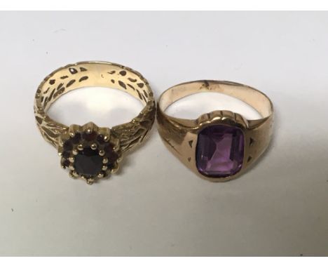 Two gold rings set with an amethyst stone and one other set with garnets. Weight 5g (2)