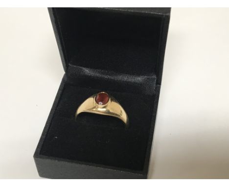 A Gents 9carat gold ring set with a cut red stone possible a Fire Opal weight 10.5g ring size Z+ 4-5