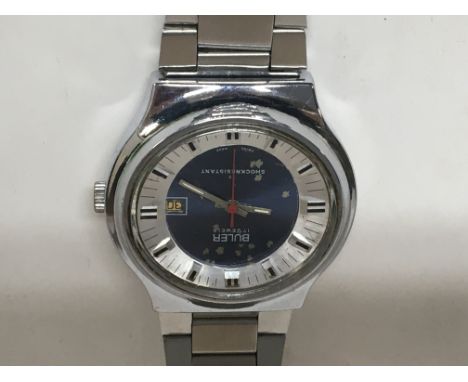 A 1970s Stainless cased Buler watch with an oval dial manual wind reverse marked MOD  DEP 10237 23031. Not seen working.
