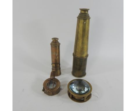 A reproduction brass telescope, 28cm unextended, together with a marching compass, a navigating compass and another telescope