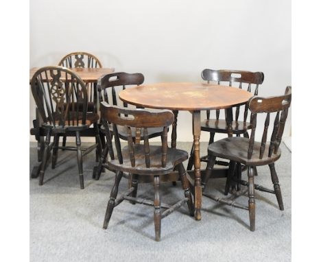 A circular dining table on turned legs, 87cm, together with a set of four spindle back dining chairs, a pine side table and t