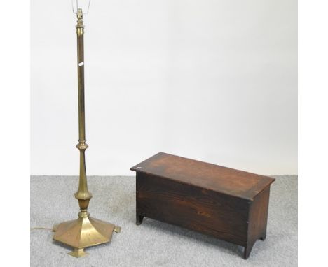 An Edwardian brass standard lamp, together with an 18th century style oak six plank coffer, 76cm