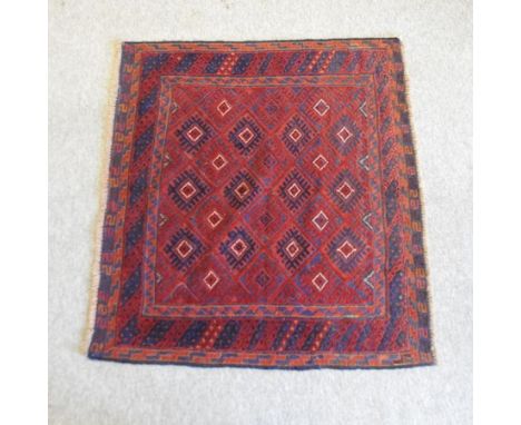 A Turkish woollen rug, with all over medallions, on a red ground, 164 x 130cm