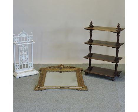 A Victorian walnut whatnot, 62cm, together with a Victorian white painted cast iron stick stand and a Victorian gilt framed w