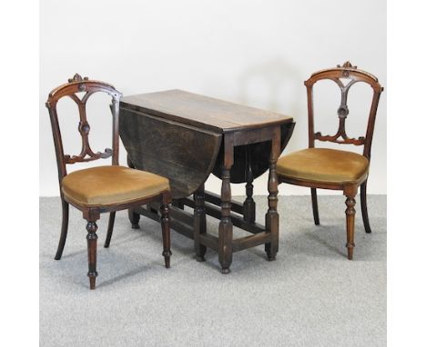 An 18th century oak drop leaf dining table 98 x 118cm, together with a pair of Victorian side chairs