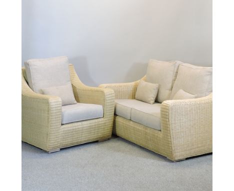 A modern wicker sofa, 150cm, together with a matching wicker armchair