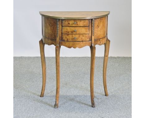 A reproduction burr walnut three drawer side table, 56cm