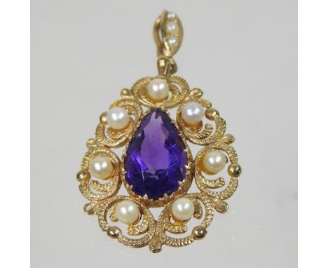 A 9 carat gold amethyst and pearl pendant, of pear shape, within in pierced surround, 2.5cm wide