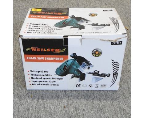 A 240v chainsaw sharpener, boxed