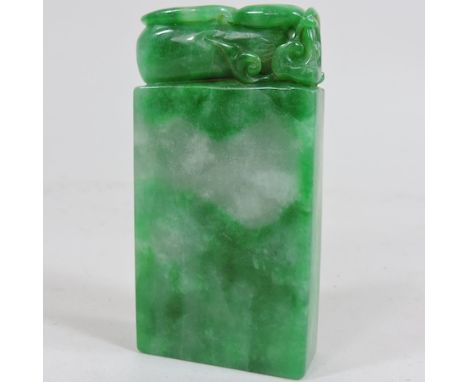 A reproduction jade coloured hardstone seal, 8cm high