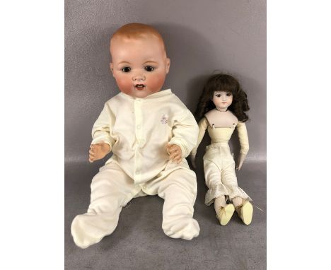 Antique Dolls, a large Armand Marseille bay doll , Stamped A.M Germany 351-/9.K, in a modern baby grow, and a female doll sta