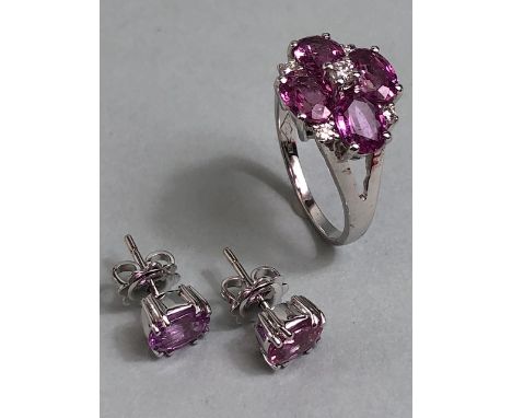 18ct White Gold ring and earring set both set with Pink Sapphires (possibly dyed) the ring set with four Sapphires interspers